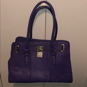 Charming Charlie purple hand bag. New